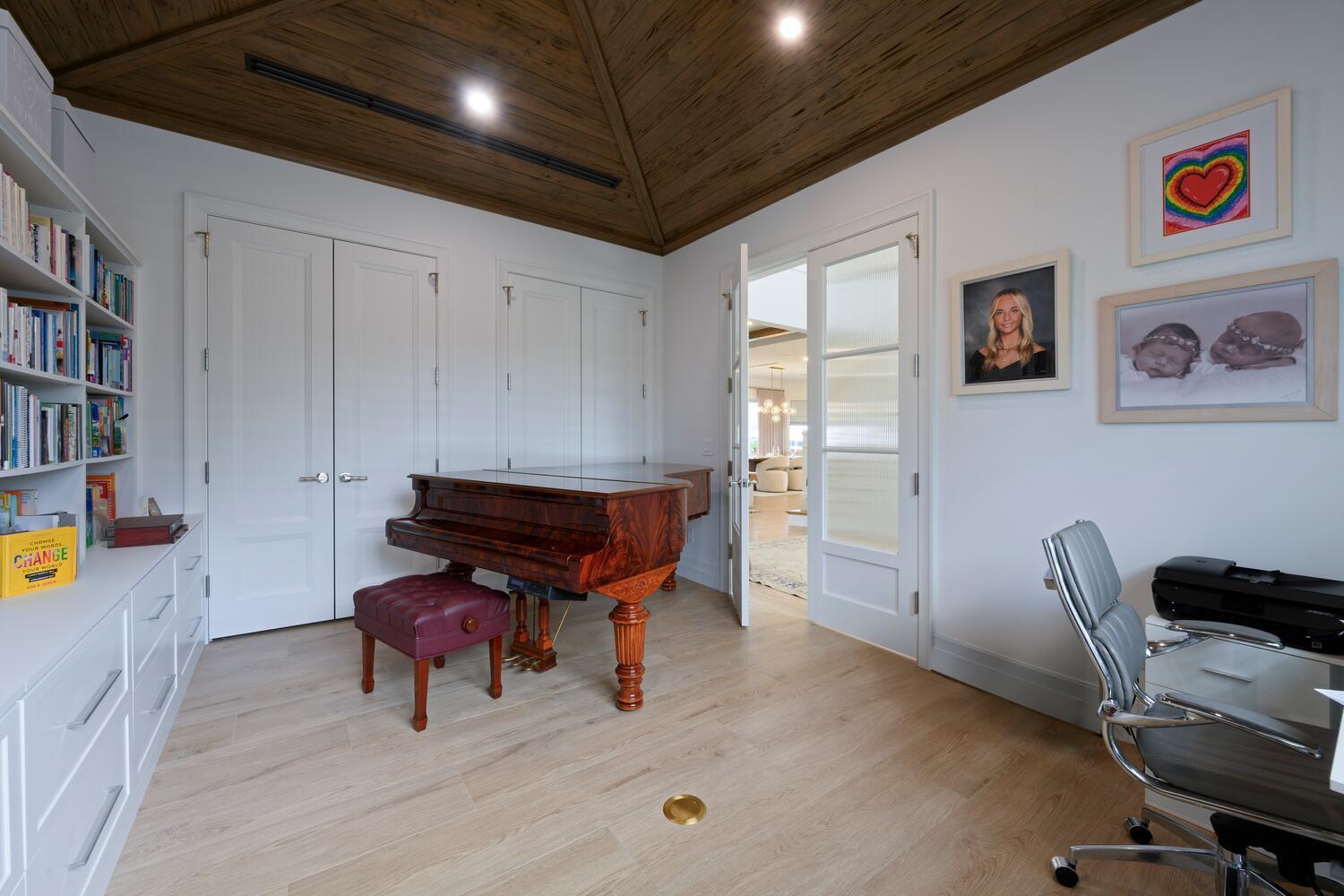 643 Pilot Road North Palm Beach, FL 33408 - Photo 20 of 73 a living room with furniture and a piano