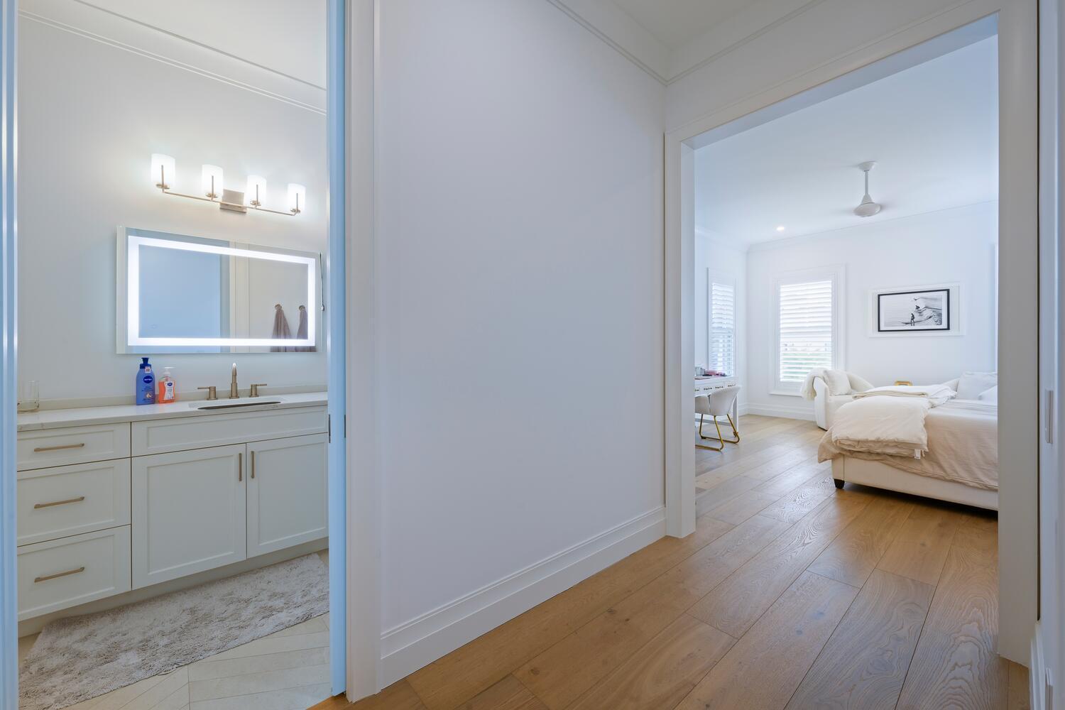 643 Pilot Road North Palm Beach, FL 33408 - Photo 29 of 73 a en suite bathroom with a granite countertop sink and a mirror