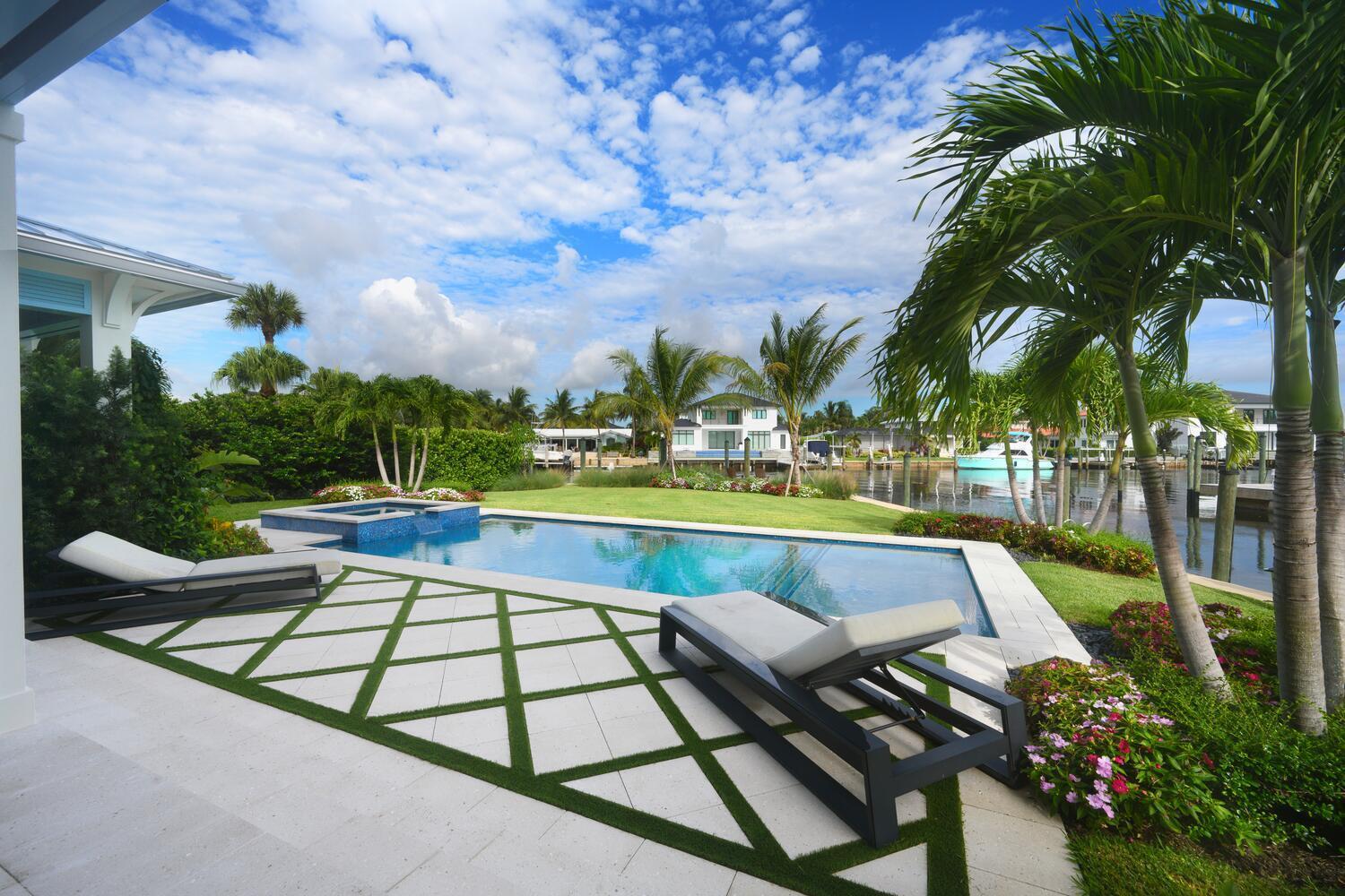 643 Pilot Road North Palm Beach, FL 33408 - Photo 40 of 73 a view of swimming pool with chairs and trees