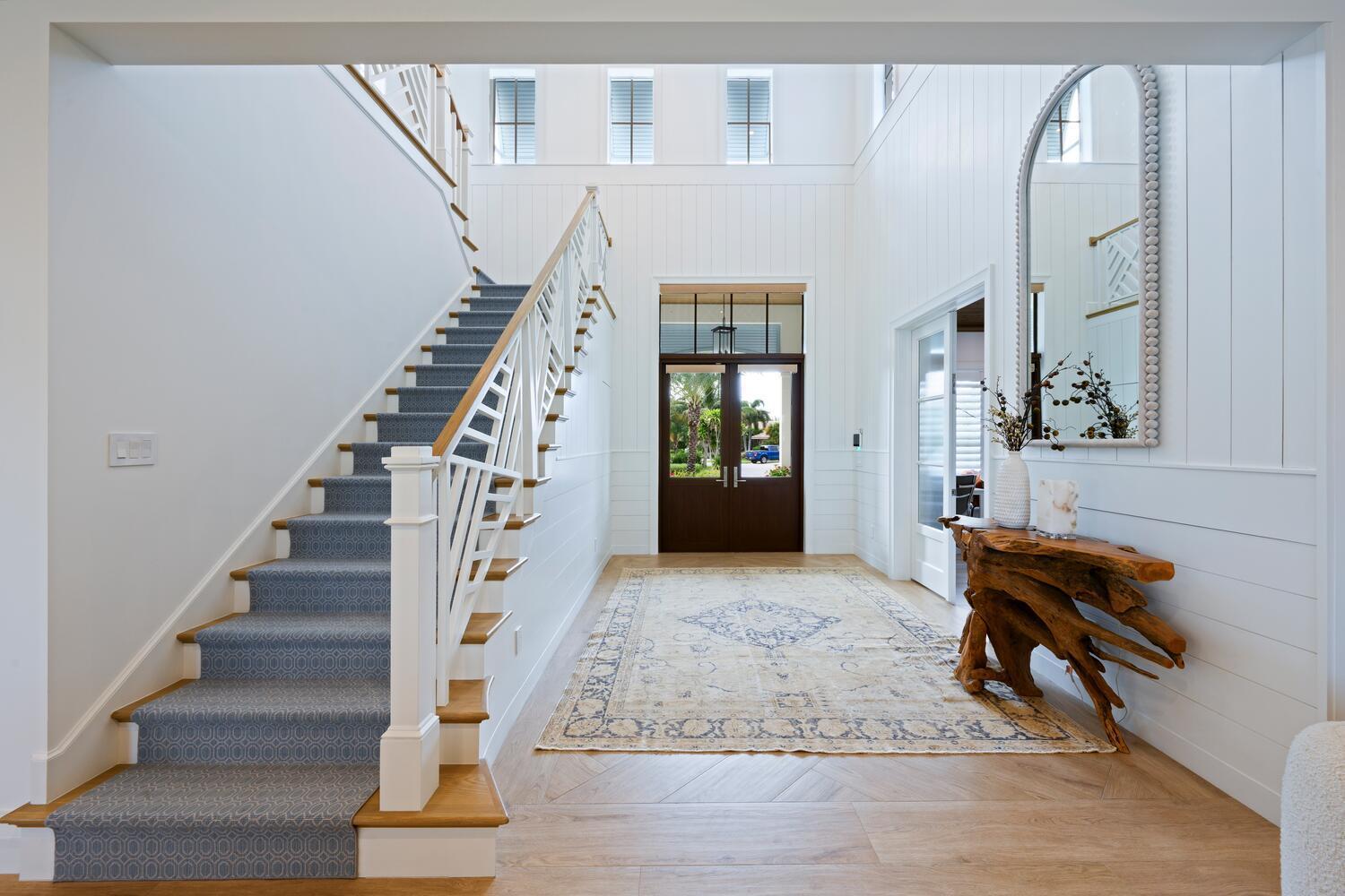 643 Pilot Road North Palm Beach, FL 33408 - Photo 4 of 73 a view of entryway and hall with wooden floor