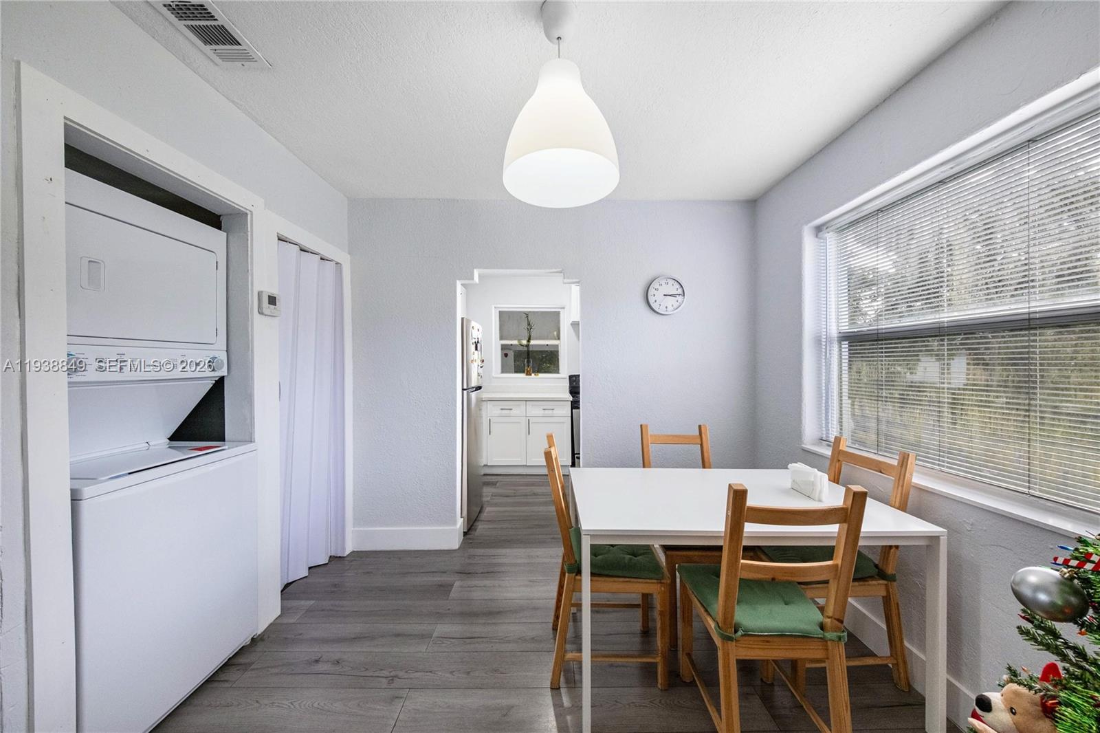 1244 Northwest 45th Street Miami, FL 33142 - Photo 6 of 23 a dining room with furniture and window