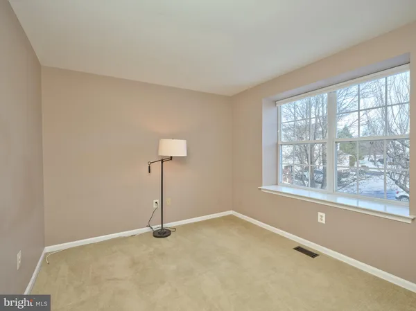 a view of a room with a large window
