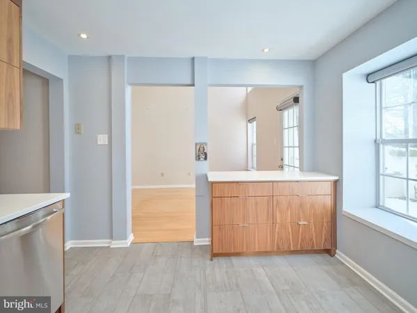 a spacious bathroom with a double vanity sink and a mirror