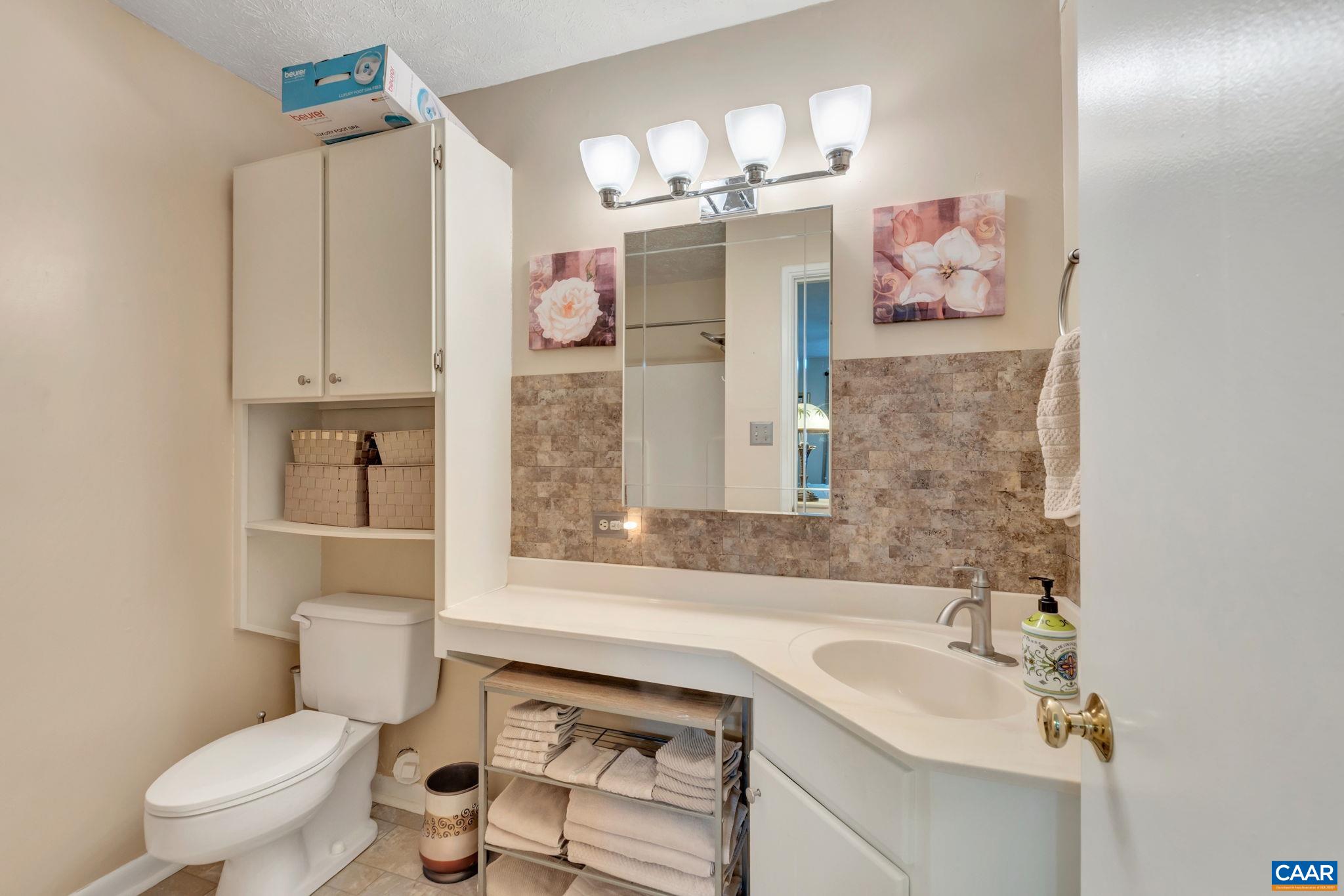 114 Turtle Creek Road, Unit 1 Charlottesville, VA 22901 - Photo 13 of 24 a bathroom with a sink toilet and shower