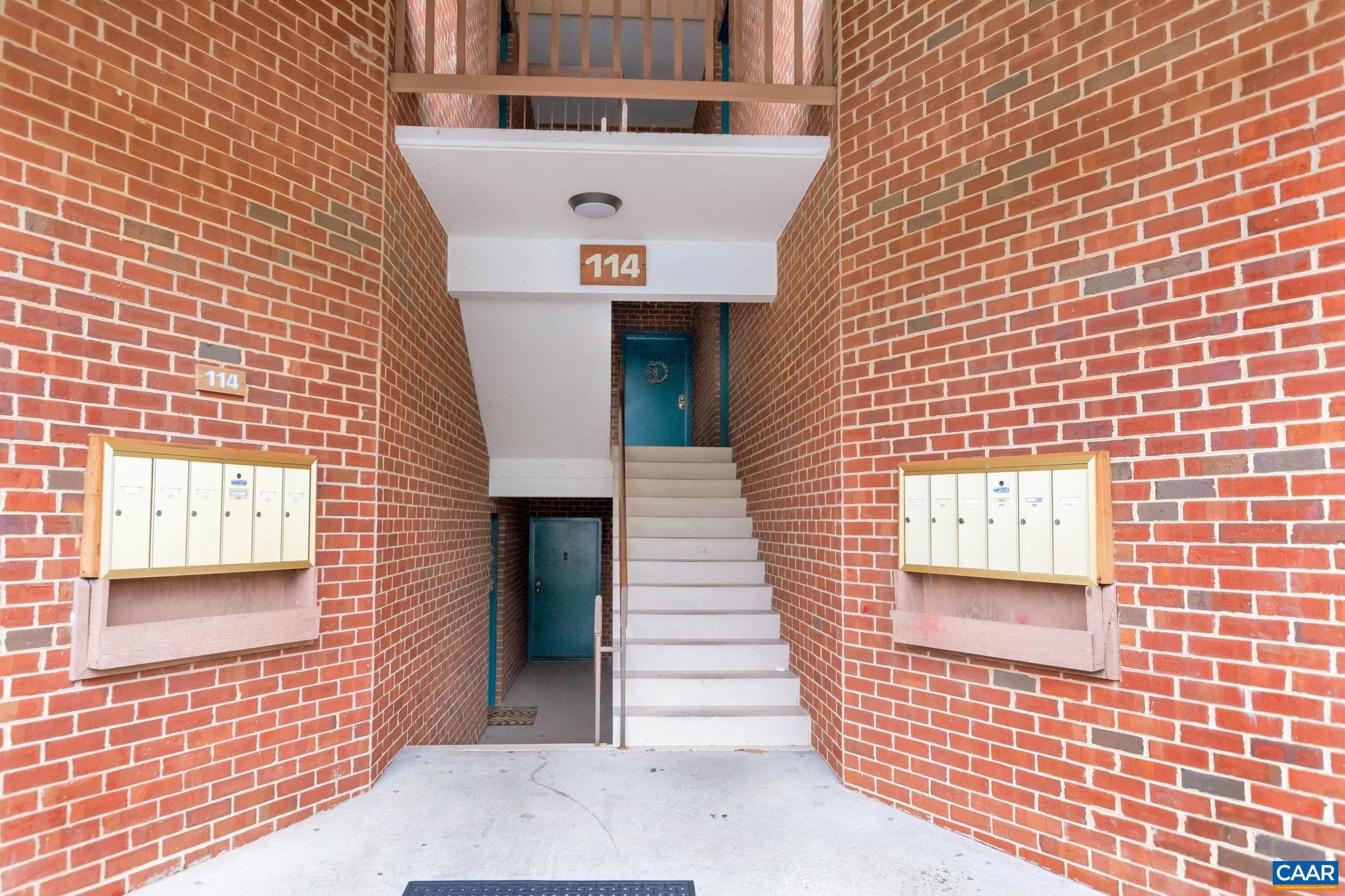 114 Turtle Creek Road, Unit 1 Charlottesville, VA 22901 - Photo 17 of 24 a view of a brick house with many windows