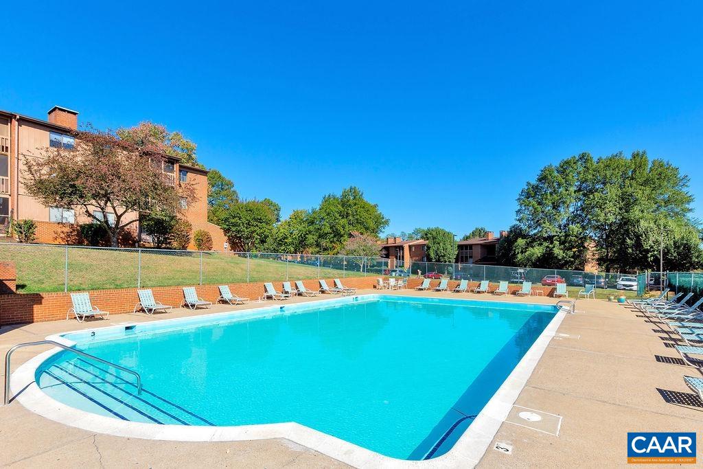 114 Turtle Creek Road, Unit 1 Charlottesville, VA 22901 - Photo 22 of 24 a view of a swimming pool with an outdoor seating