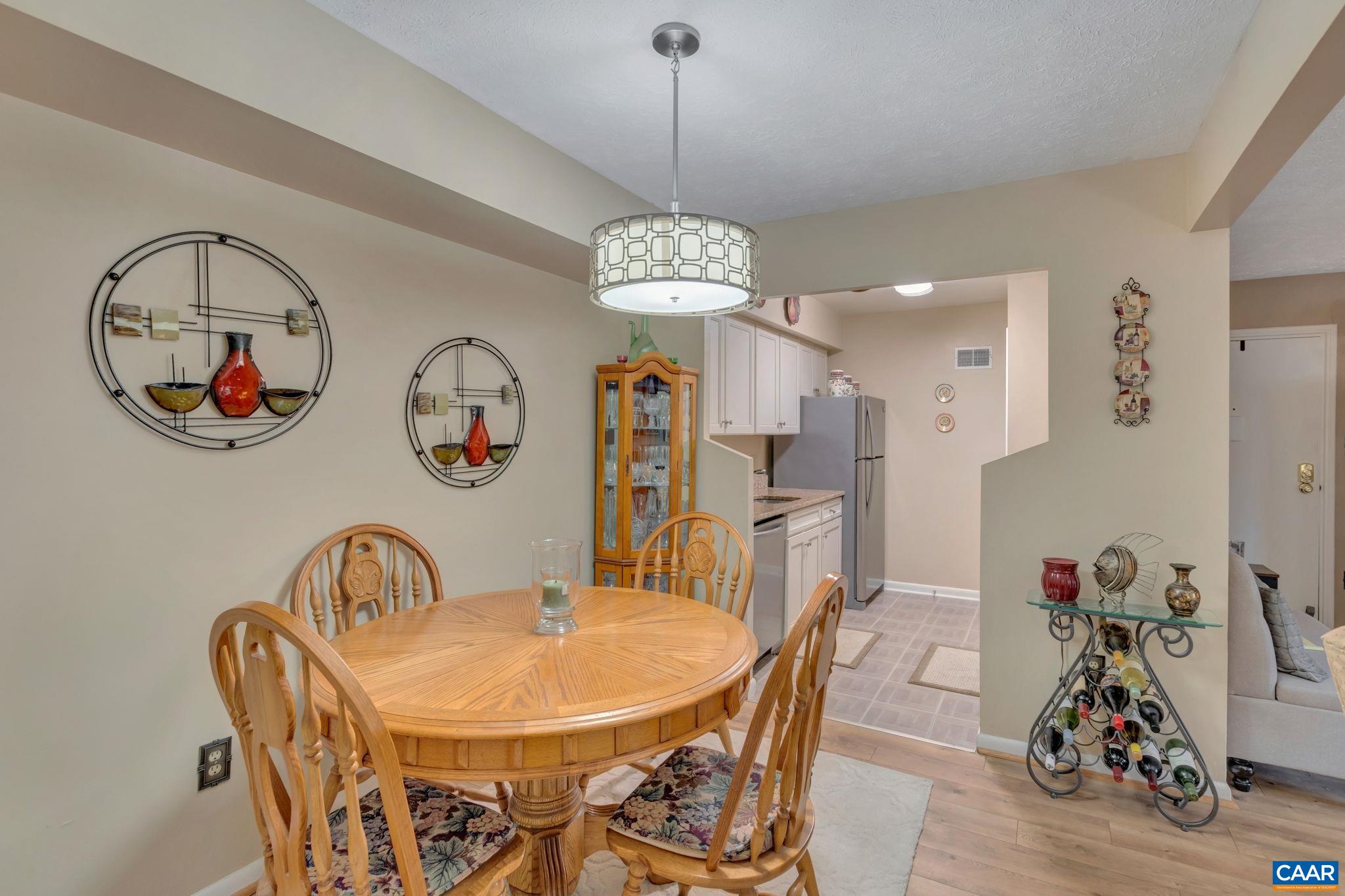 114 Turtle Creek Road, Unit 1 Charlottesville, VA 22901 - Photo 6 of 24 a view of a dining room with furniture and chandelier