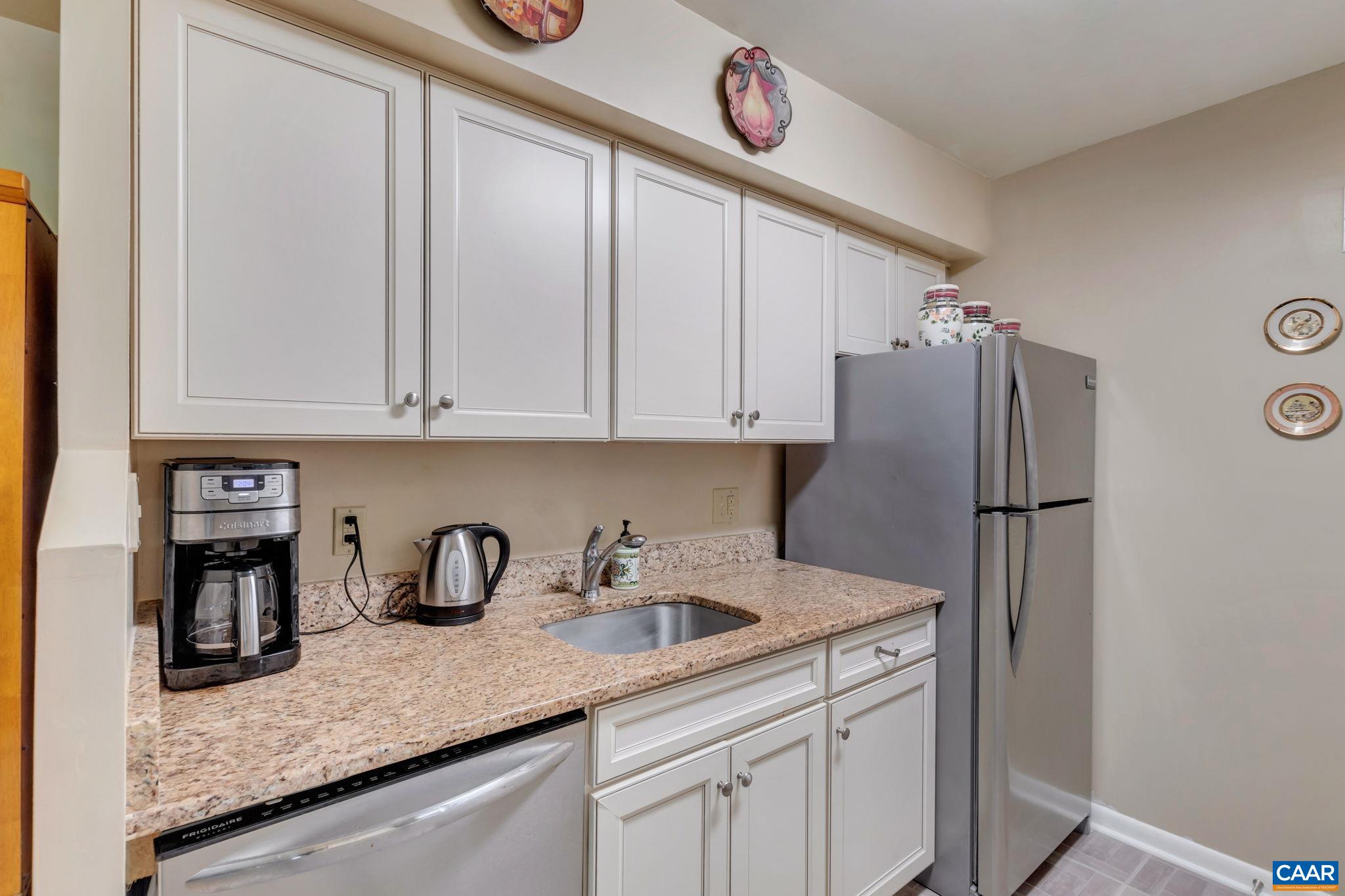 114 Turtle Creek Road, Unit 1 Charlottesville, VA 22901 - Photo 9 of 24 a kitchen with stainless steel appliances granite countertop a refrigerator and a sink