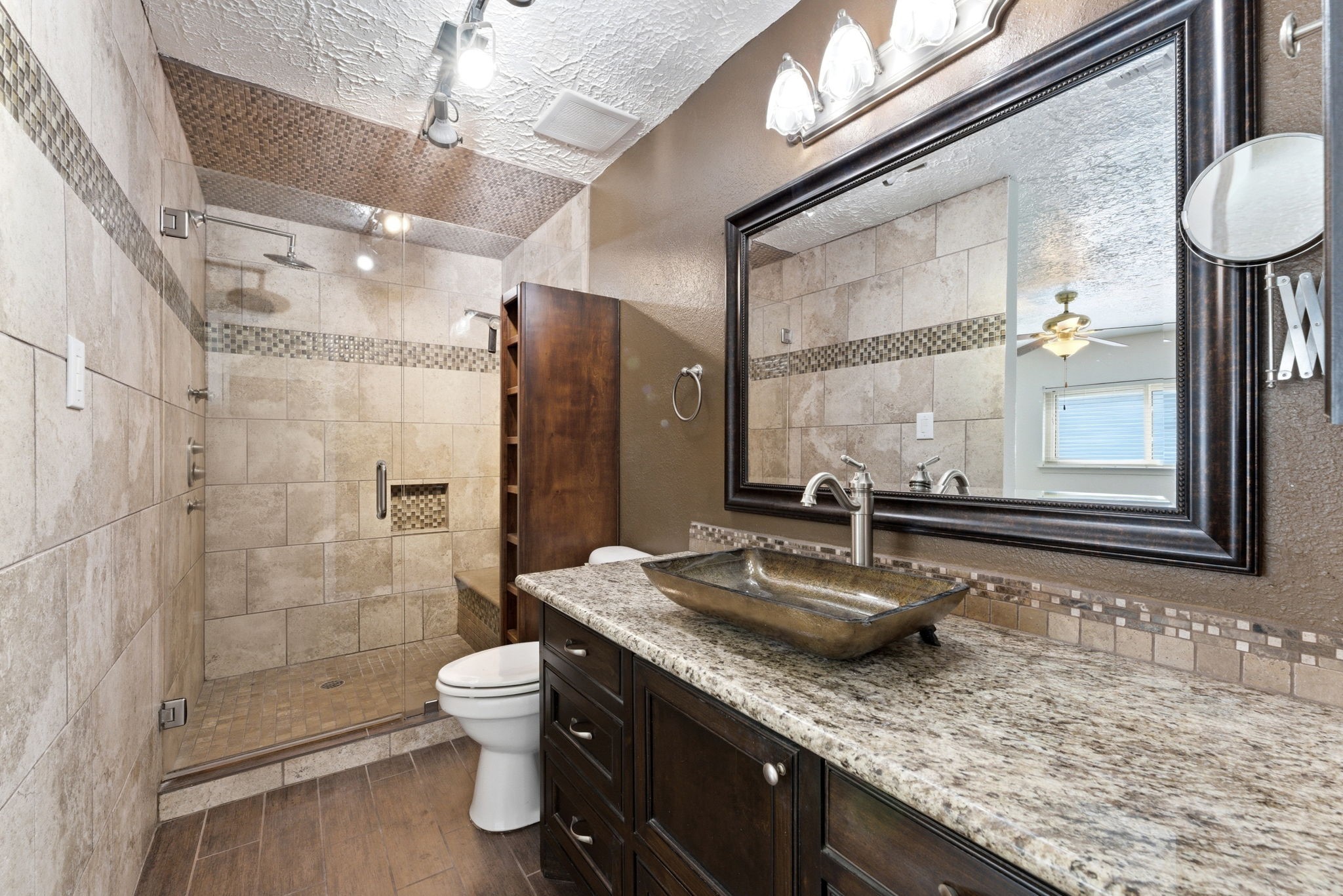21514 Slippery Creek Lane Spring, TX 77388 - Photo 16 of 27 a bathroom with a granite countertop sink toilet and shower