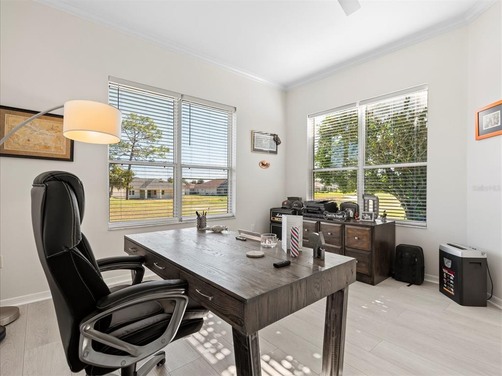 9182 Tarleton Circle Weeki Wachee, FL 34613 - Photo 15 of 23 a view of a dining room with furniture window and outside view