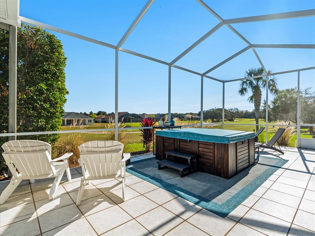 9182 Tarleton Circle Weeki Wachee, FL 34613 - Photo 16 of 23 a backyard of a house with outdoor seating