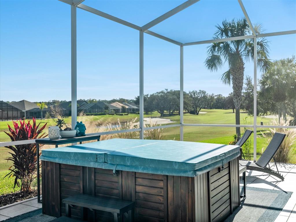 9182 Tarleton Circle Weeki Wachee, FL 34613 - Photo 17 of 23 a view of a swimming pool with a lounge chairs