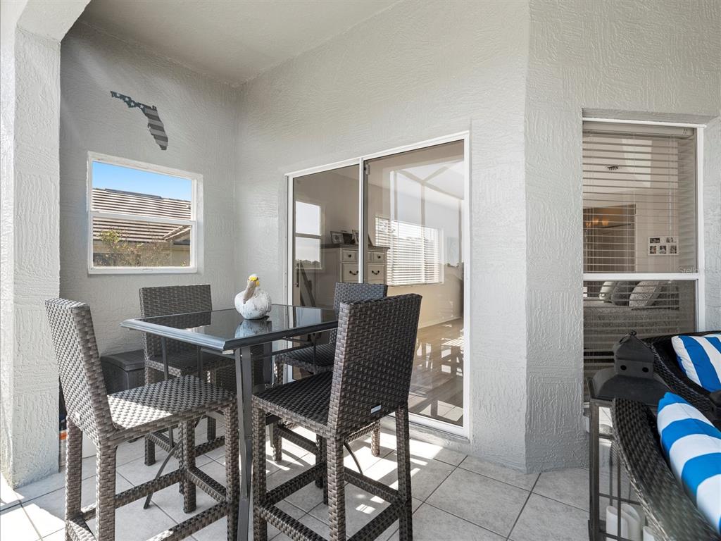 9182 Tarleton Circle Weeki Wachee, FL 34613 - Photo 19 of 23 a view of a dining room with furniture and window