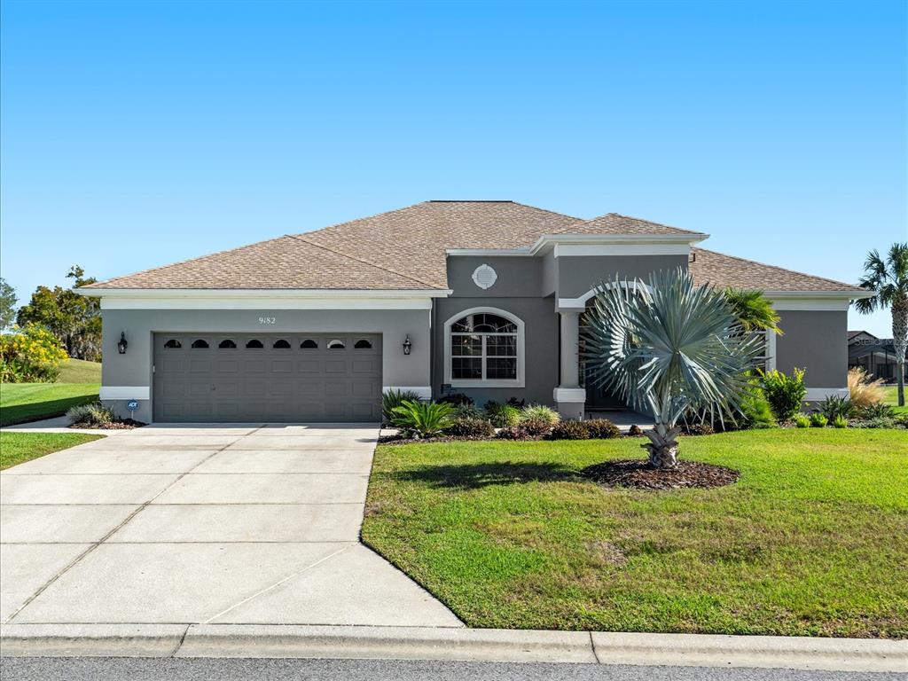 9182 Tarleton Circle Weeki Wachee, FL 34613 - Photo 2 of 23 a front view of house with yard