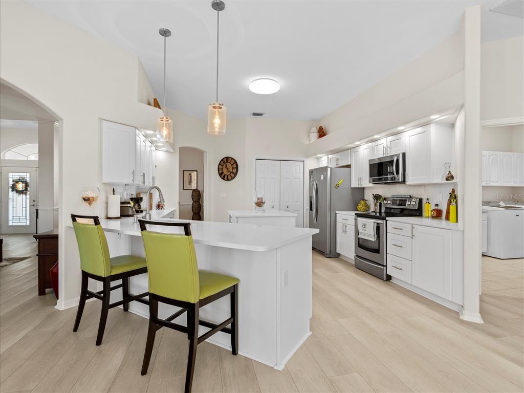 9182 Tarleton Circle Weeki Wachee, FL 34613 - Photo 6 of 23 a view of kitchen with cabinets and stainless steel appliances