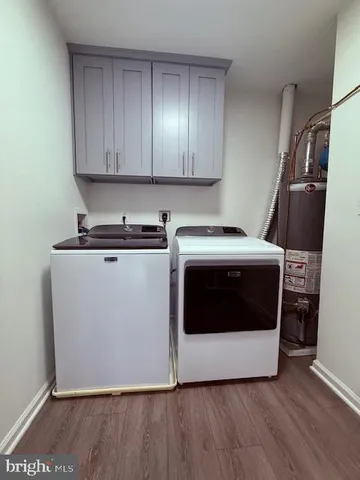 a utility room with washer and dryer