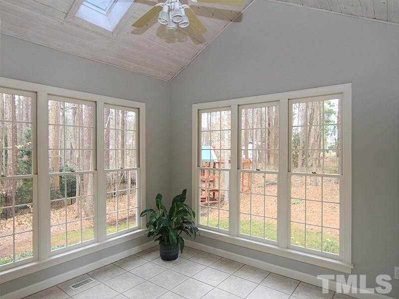 7023 Spring Ridge Road Cary, NC 27518 - Photo 5 of 12 This fabulous light filled room overlooks the brick patio and children's play set which conveys.