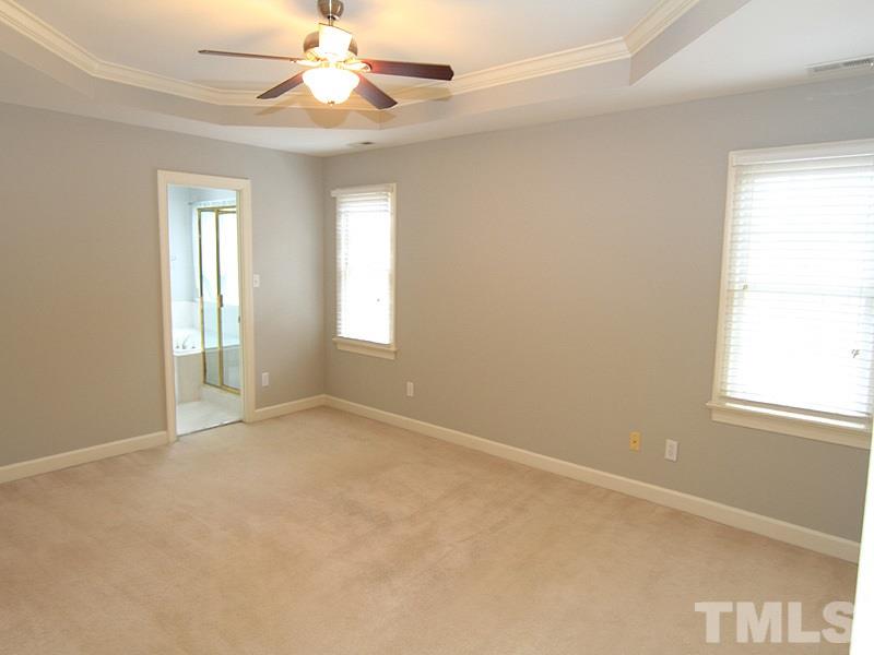 7023 Spring Ridge Road Cary, NC 27518 - Photo 8 of 12 Master bedroom with trey ceiling and his and her closets.
