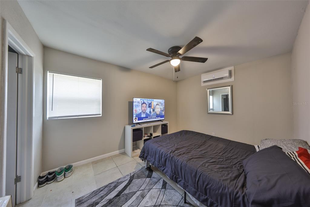11708 Balm Riverview Road Riverview, FL 33569 - Photo 7 of 37 a bedroom with a bed and a chandelier