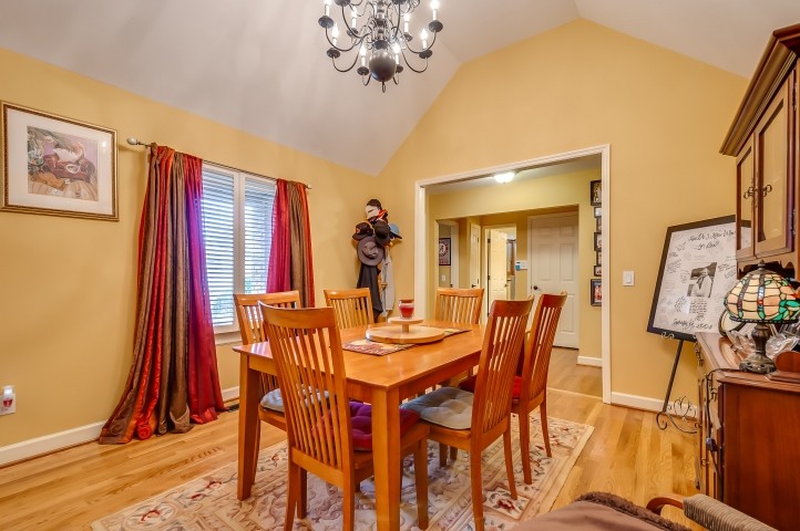 7357 Overby Road Fairview, TN 37062 - Photo 4 of 15 a view of a dining room with furniture and wooden floor
