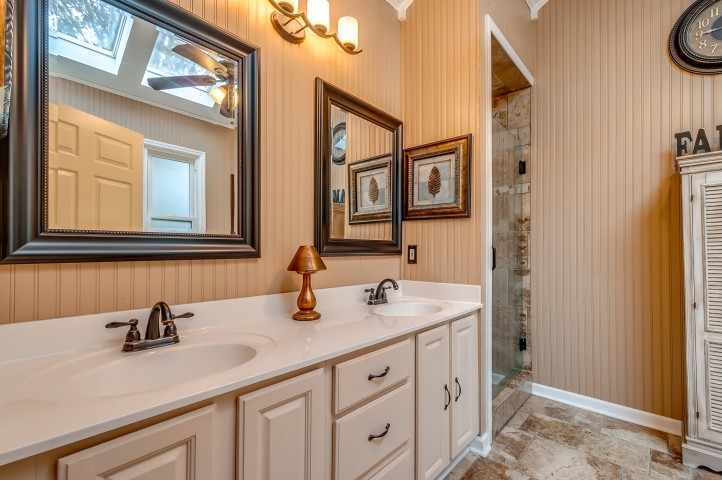 7357 Overby Road Fairview, TN 37062 - Photo 8 of 15 a bathroom with a sink and a mirror