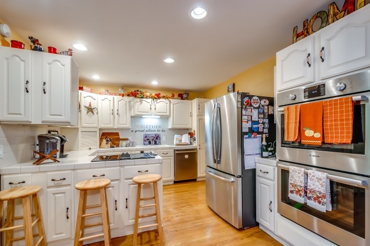 7357 Overby Road Fairview, TN 37062 - Photo 10 of 15 a kitchen with refrigerator and cabinets