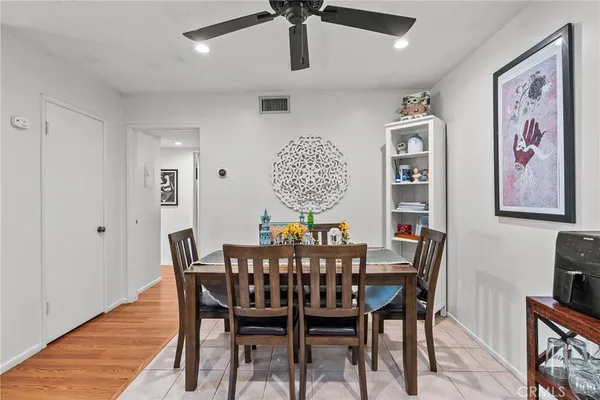 a view of a dining room with furniture wooden floor and chandelier