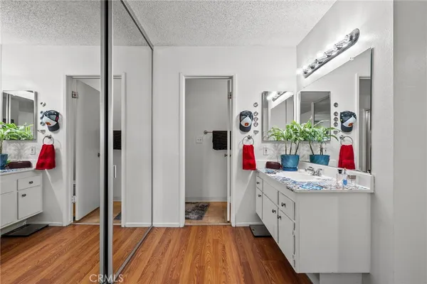 a spacious bathroom with a sink mirror and shower