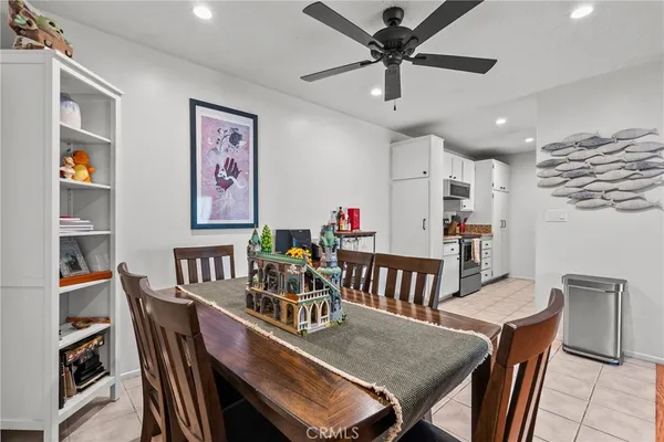 a dining room with furniture and a chandelier