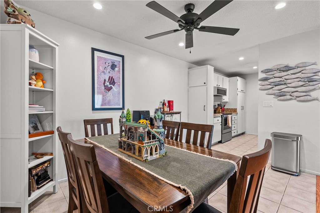 25736 Player Drive, Unit R4 Valencia, CA 91355 - Photo 3 of 50 a dining room with furniture and a chandelier