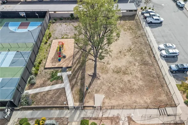 an aerial view of residential houses with outdoor space