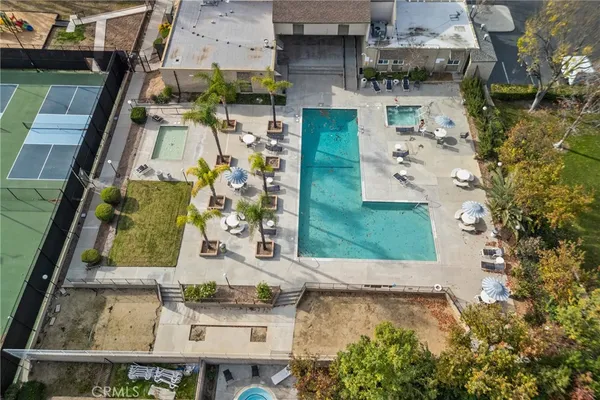 an aerial view of residential houses with outdoor space