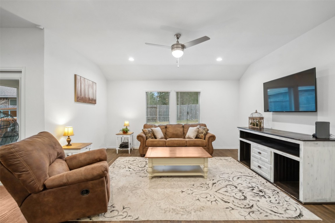 3308 Cold Swan Court Conroe, TX 77301 - Photo 15 of 25 Family room features comfortable seating and wall mounted TV.