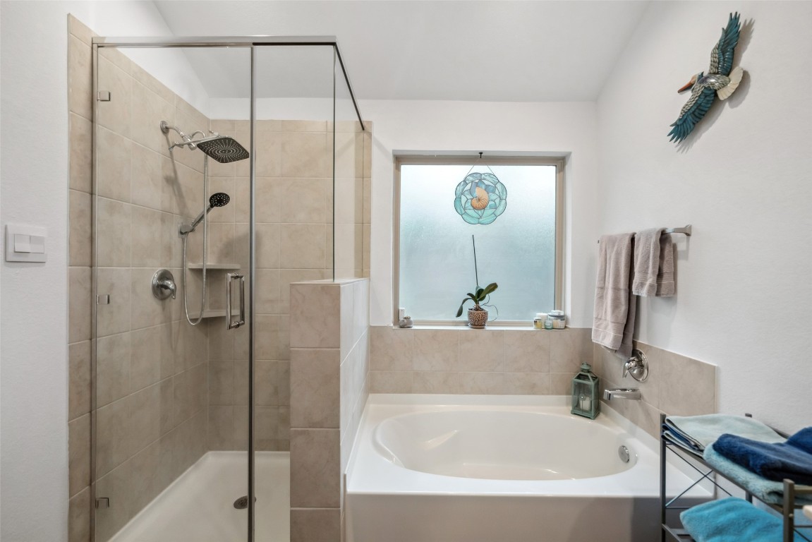 3308 Cold Swan Court Conroe, TX 77301 - Photo 22 of 25 Primary suite features large soaking tub with separate shower, double vanity sink and large walkin closet. Comes furnished with towels and linens.