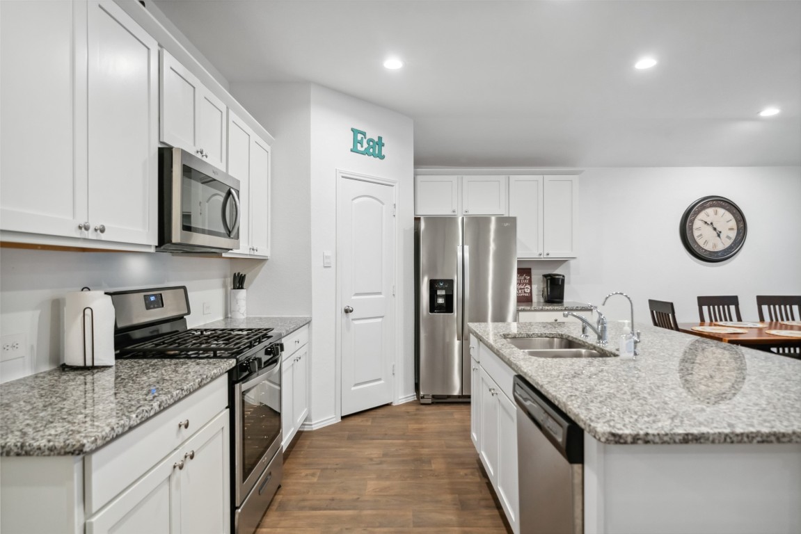3308 Cold Swan Court Conroe, TX 77301 - Photo 8 of 25 Kitchen features SS appliances, granite countertops & large walk in pantry.