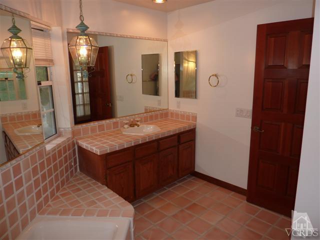 51 Buckskin Road Bell Canyon, CA 91307 - Photo 16 of 24 a bathroom with a sink and a mirror