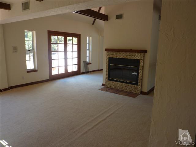 51 Buckskin Road Bell Canyon, CA 91307 - Photo 20 of 24 an empty room with windows and fireplace