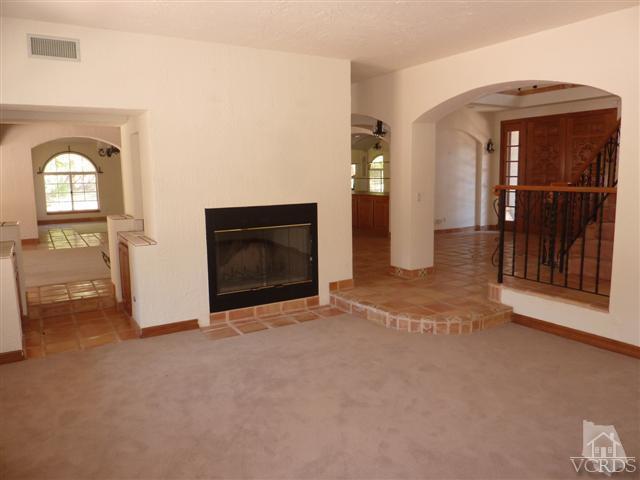 51 Buckskin Road Bell Canyon, CA 91307 - Photo 8 of 24 a view of an empty room with a fireplace and a window