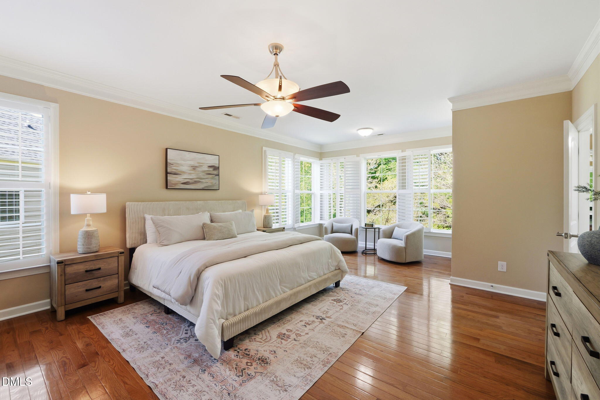 804 Long Meadows Road Chapel Hill, NC 27516 - Photo 23 of 50 a bedroom with a large bed and a chandelier