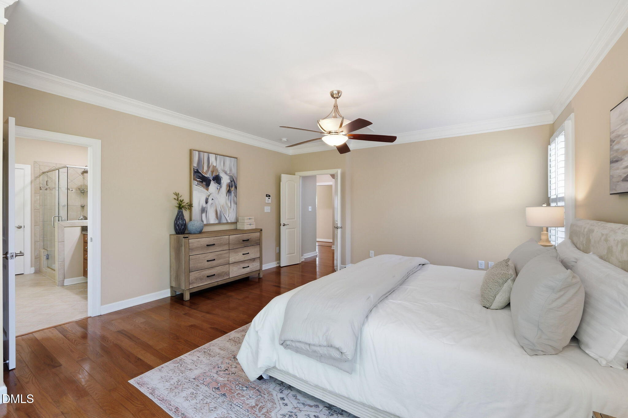 804 Long Meadows Road Chapel Hill, NC 27516 - Photo 25 of 50 a bedroom with a bed and wooden floor