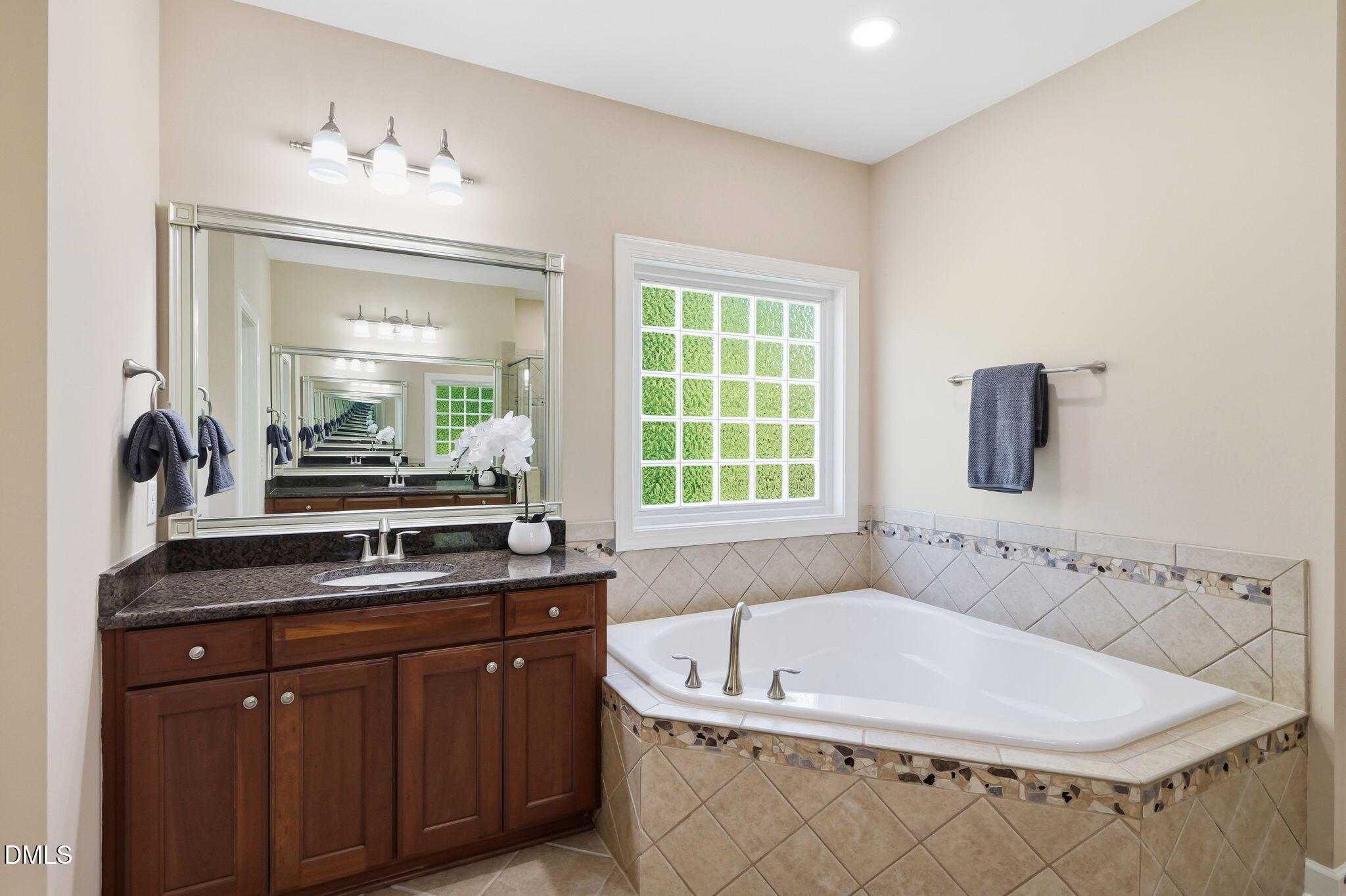804 Long Meadows Road Chapel Hill, NC 27516 - Photo 27 of 50 a bath tub sitting next to a bathroom sink