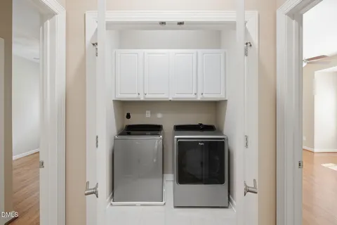 an empty room with wooden floor a ceiling fan and closet