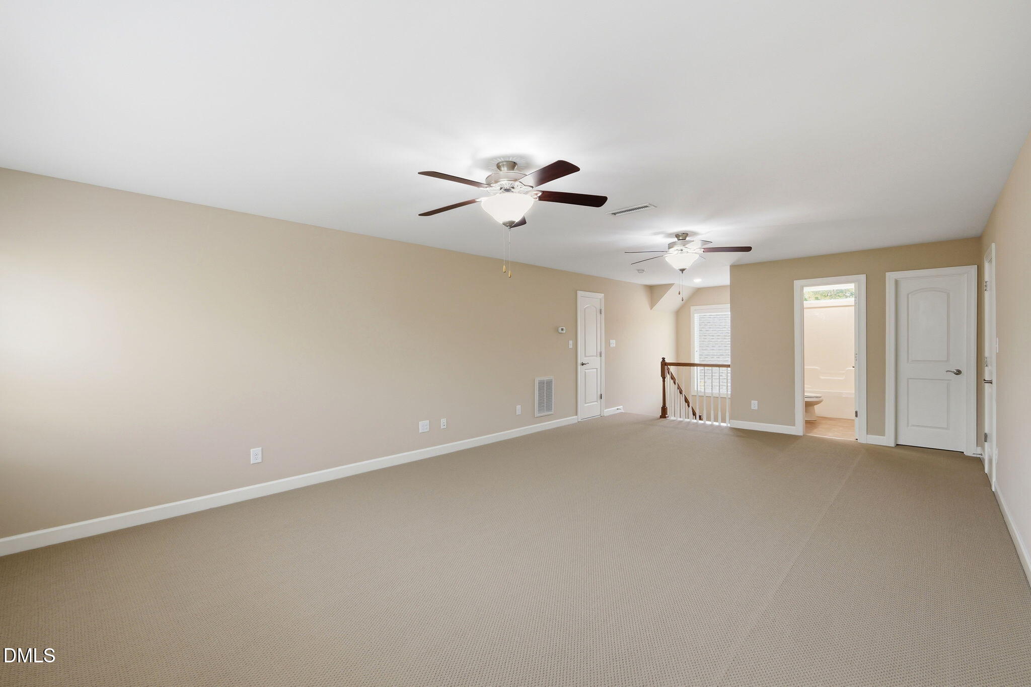 804 Long Meadows Road Chapel Hill, NC 27516 - Photo 39 of 50 an empty room with chandelier fan and windows