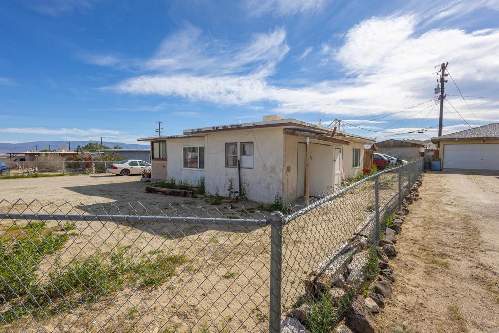 13765 Fremont Street Trona, CA 93562 - Photo 1 of 31 a view of a house with a yard