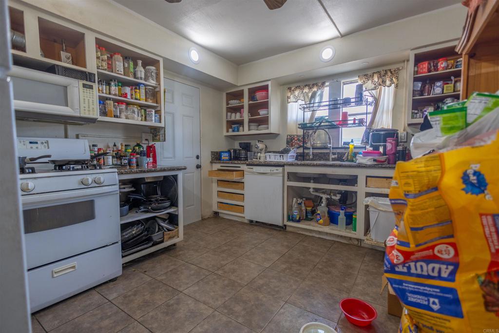 13765 Fremont Street Trona, CA 93562 - Photo 16 of 31 a kitchen with a stove and cabinets