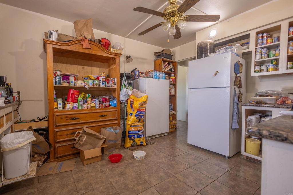 13765 Fremont Street Trona, CA 93562 - Photo 17 of 31 a storage room with washer and dryer