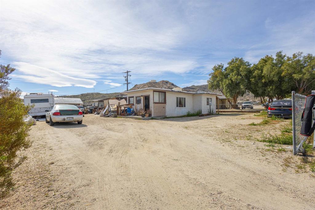 13765 Fremont Street Trona, CA 93562 - Photo 2 of 31 a car parked in front of a house