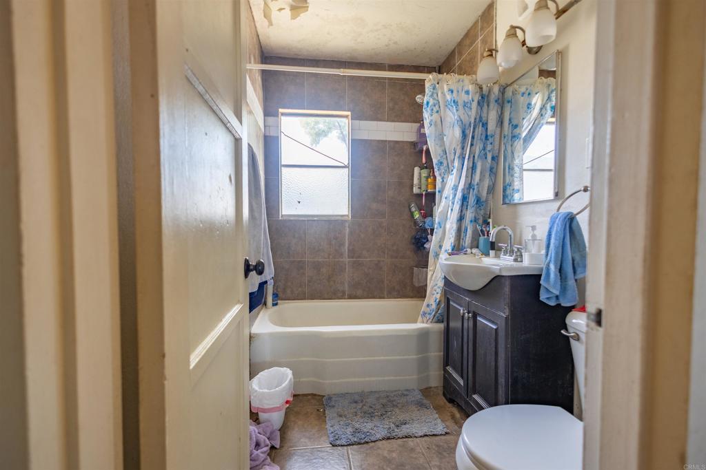 13765 Fremont Street Trona, CA 93562 - Photo 21 of 31 a bathroom with a sink toilet and shower