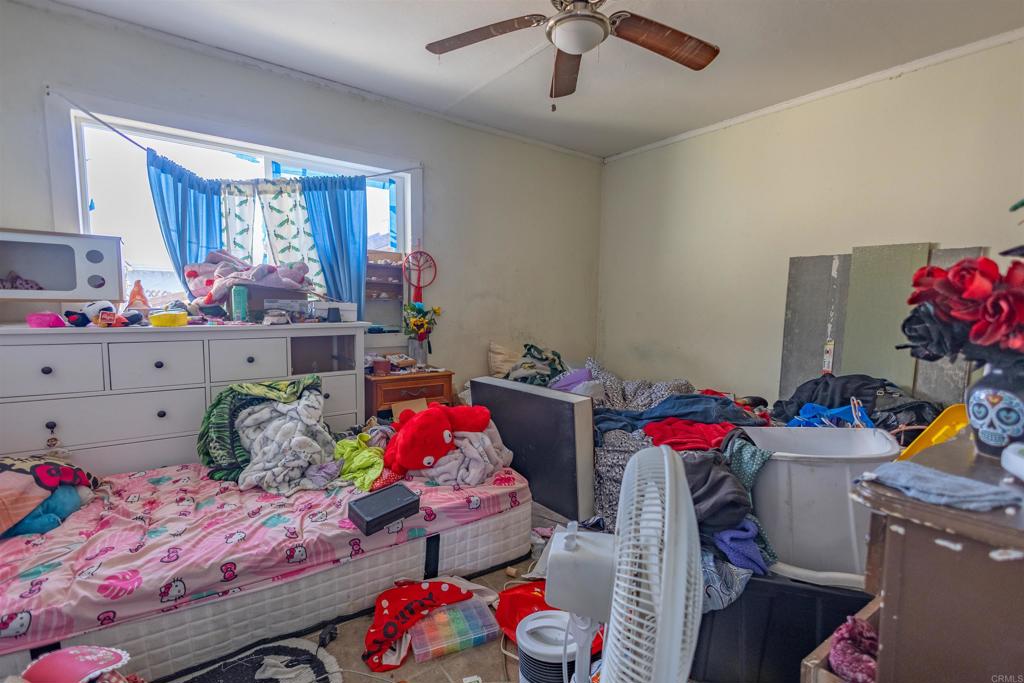 13765 Fremont Street Trona, CA 93562 - Photo 23 of 31 a bedroom with furniture and a window