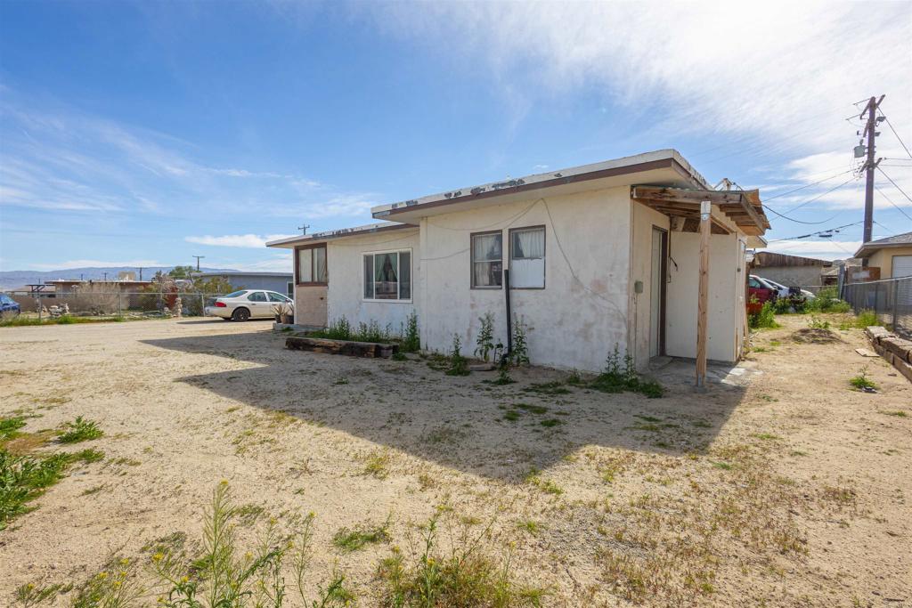 13765 Fremont Street Trona, CA 93562 - Photo 6 of 31 a view of a house with a backyard